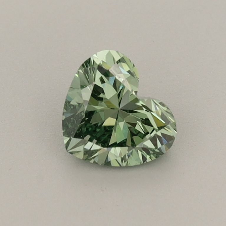 Loose Diamond - HEART 0.54ct Fancy Vivid Green VVS2: Loose Diamond - HEART 0.54ct Fancy Vivid Green VVS2 Source: This is a real non-mined Diamond that has been grown in a lab Shape: HEART Carats: 0.54 Color: Fancy Vivid Green Certification: IGI The Diam