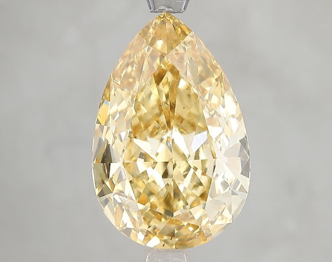 Loose Diamond - PEAR 5.02ct Fancy Vivid Yellow VS2: Loose Diamond - PEAR 5.02ct Fancy Vivid Yellow VS2 Source: This is a real non-mined Diamond that has been grown in a lab Shape: PEAR Carats: 5.02 Color: Fancy Vivid Yellow Certification: IGI Video: