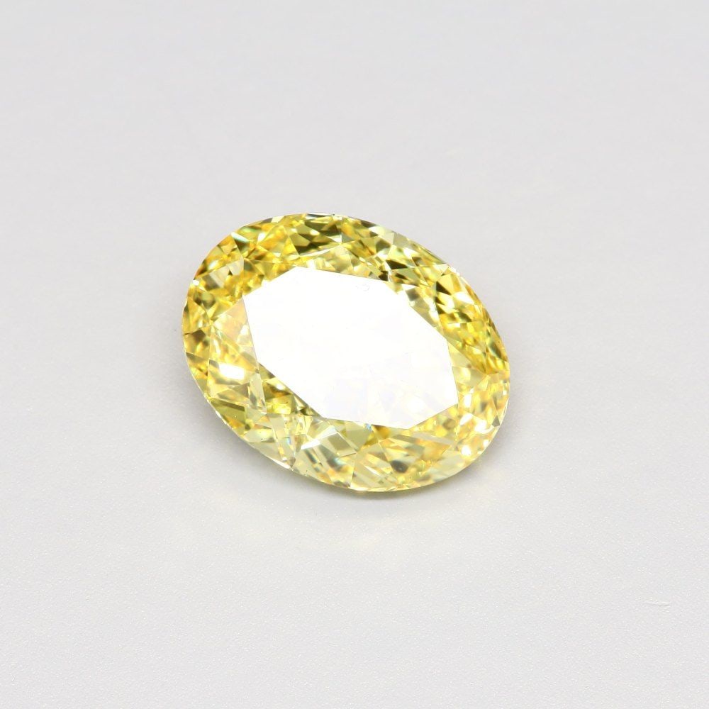 Loose Diamond - OVAL 5.05ct Fancy Vivid Yellow VS2: Loose Diamond - OVAL 5.05ct Fancy Vivid Yellow VS2 Source: This is a real non-mined Diamond that has been grown in a lab Shape: OVAL Carats: 5.05 Color: Fancy Vivid Yellow Certification: IGI Video: