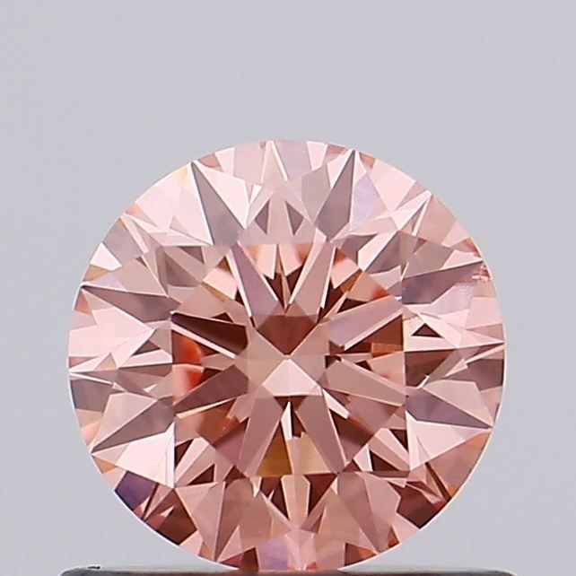 Ideal Loose Diamond - ROUND 0.65ct Fancy Vivid Pink VS1: Ideal Loose Diamond - ROUND 0.65ct Fancy Vivid Pink VS1 Source: This is a real non-mined Diamond that has been grown in a lab Shape: ROUND Carats: 0.65 Color: Fancy Vivid Pink Certification: IGI Video