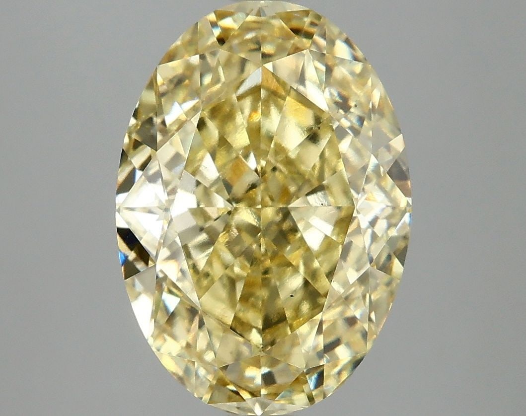Loose Diamond - OVAL 5.05ct Fancy Vivid Yellow VS2: Loose Diamond - OVAL 5.05ct Fancy Vivid Yellow VS2 Source: This is a real non-mined Diamond that has been grown in a lab Shape: OVAL Carats: 5.05 Color: Fancy Vivid Yellow Certification: IGI Video: