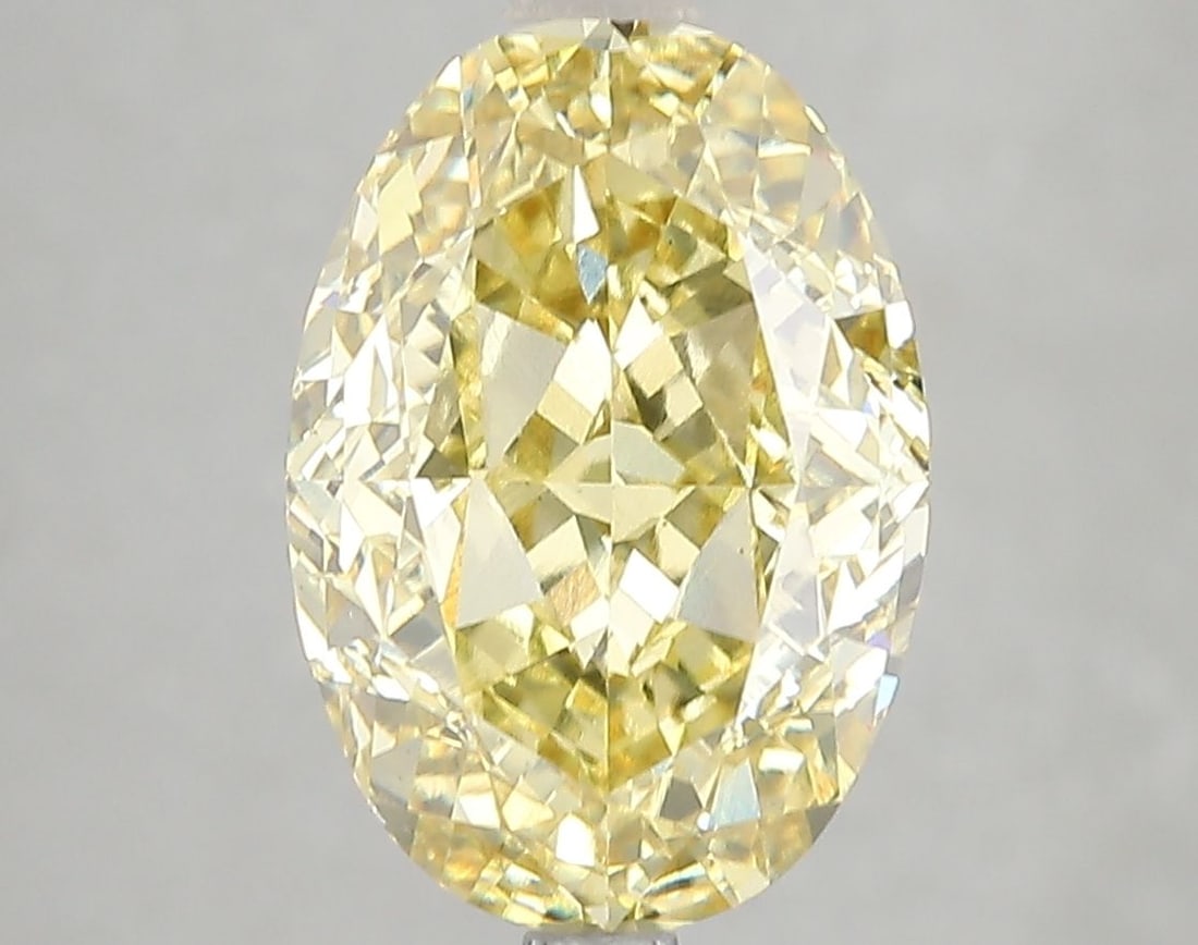 Loose Diamond - OVAL 5.08ct Fancy Vivid Yellow VS1: Loose Diamond - OVAL 5.08ct Fancy Vivid Yellow VS1 Source: This is a real non-mined Diamond that has been grown in a lab Shape: OVAL Carats: 5.08 Color: Fancy Vivid Yellow Certification: IGI Video: