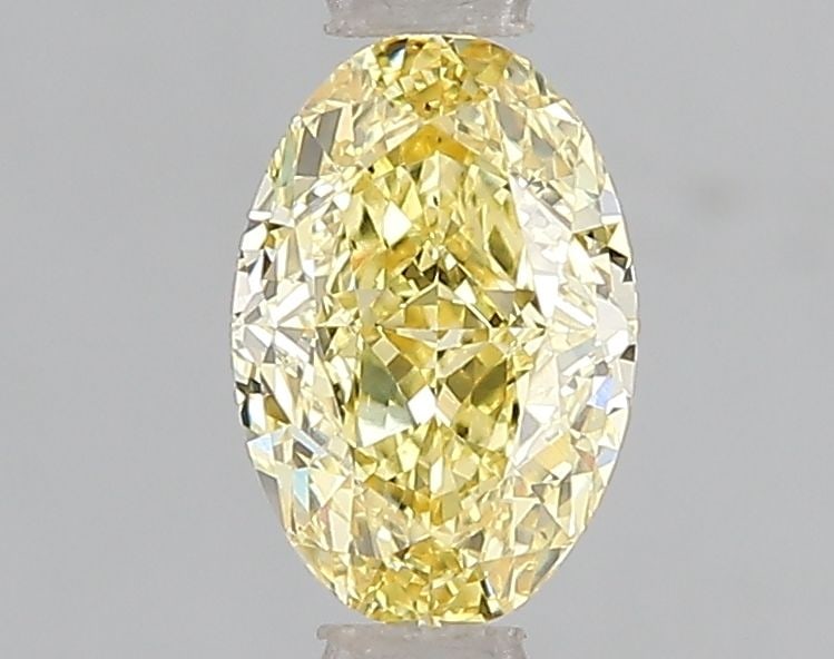 Loose Diamond - OVAL 1.05ct Fancy Vivid Yellow VS2: Loose Diamond - OVAL 1.05ct Fancy Vivid Yellow VS2 Source: This is a real non-mined Diamond that has been grown in a lab Shape: OVAL Carats: 1.05 Color: Fancy Vivid Yellow Certification: IGI Video: