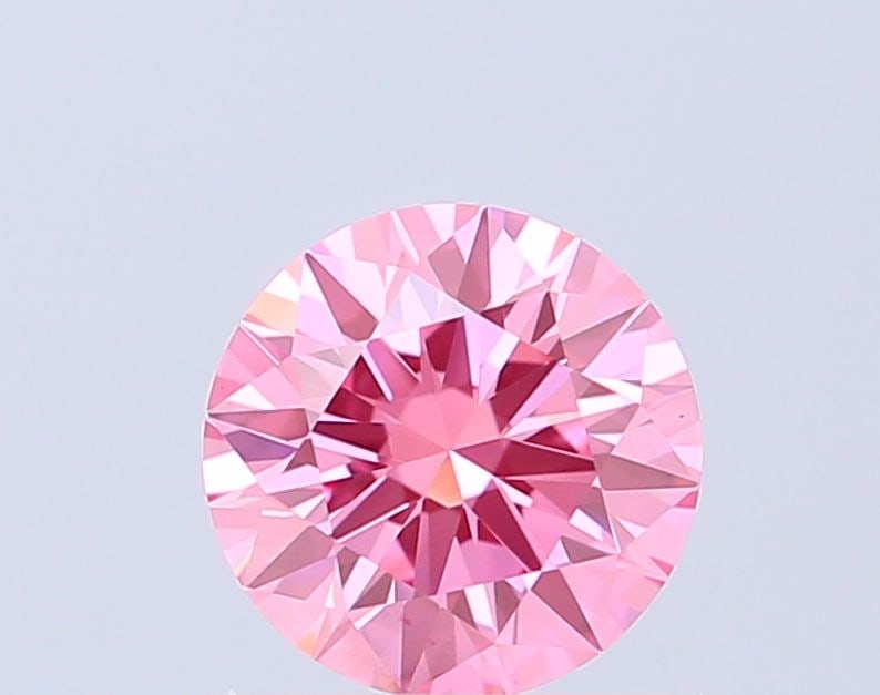 Ideal Loose Diamond - ROUND 0.91ct Fancy Vivid Pink VS1: Ideal Loose Diamond - ROUND 0.91ct Fancy Vivid Pink VS1 Source: This is a real non-mined Diamond that has been grown in a lab Shape: ROUND Carats: 0.91 Color: Fancy Vivid Pink Certification: IGI The D