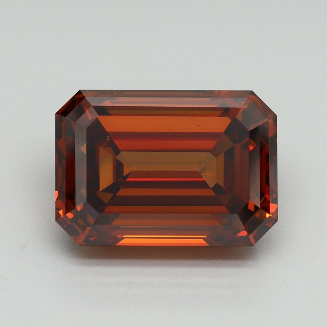 Loose Diamond - EMERALD 5.15ct Fancy Deep Orange VS2: Loose Diamond - EMERALD 5.15ct Fancy Deep Orange VS2 Source: This is a real non-mined Diamond that has been grown in a lab Shape: EMERALD Carats: 5.15 Color: Fancy Deep Orange Certification: IGI Video