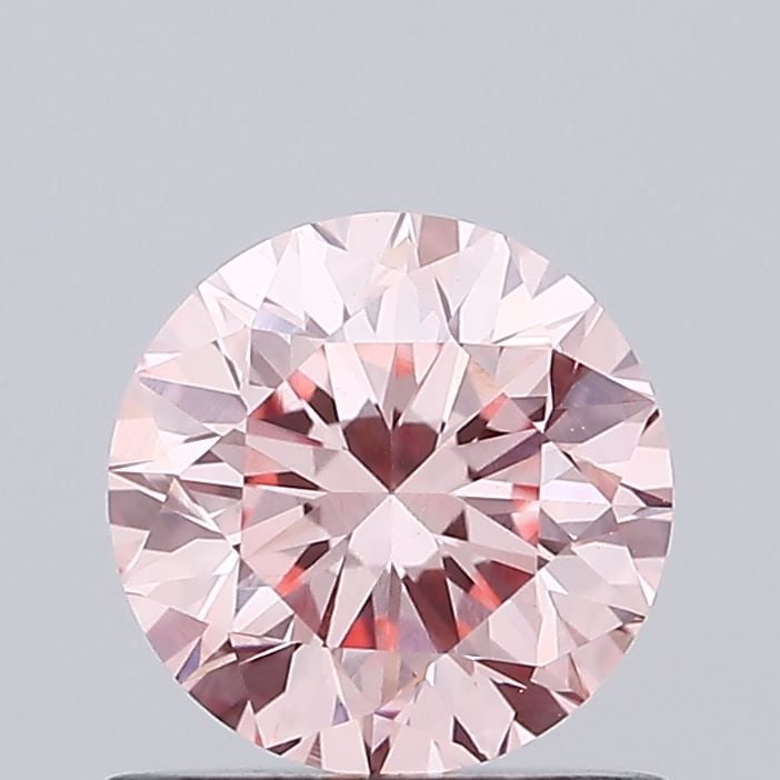 Loose Diamond - ROUND 0.81ct Fancy Vivid Pink VVS2: Loose Diamond - ROUND 0.81ct Fancy Vivid Pink VVS2 Source: This is a real non-mined Diamond that has been grown in a lab Shape: ROUND Carats: 0.81 Color: Fancy Vivid Pink Certification: IGI Video:
