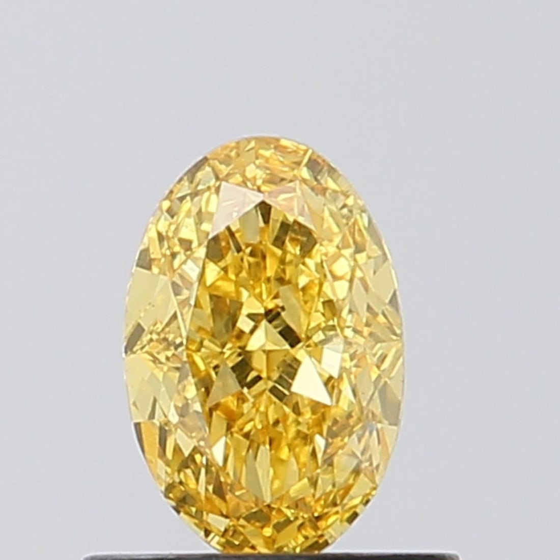 Loose Diamond - OVAL 0.71ct Fancy Vivid Yellow VVS2: Loose Diamond - OVAL 0.71ct Fancy Vivid Yellow VVS2 Source: This is a real non-mined Diamond that has been grown in a lab Shape: OVAL Carats: 0.71 Color: Fancy Vivid Yellow Certification: NONE Video: