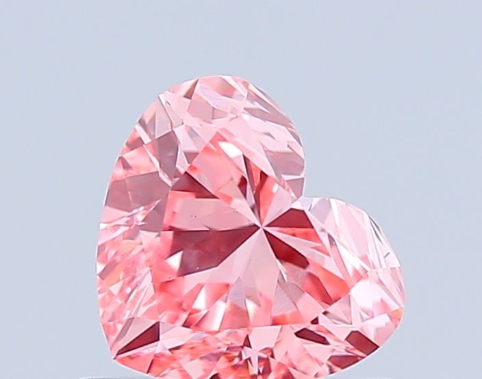 Loose Diamond - HEART 0.67ct Fancy Vivid Pink VS1: Loose Diamond - HEART 0.67ct Fancy Vivid Pink VS1 Source: This is a real non-mined Diamond that has been grown in a lab Shape: HEART Carats: 0.67 Color: Fancy Vivid Pink Certification: IGI Video: