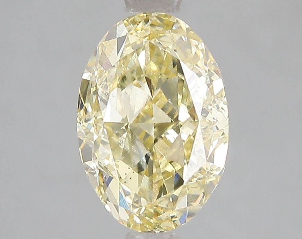 Loose Diamond - OVAL 3.01ct Fancy Vivid Yellow VS1: Loose Diamond - OVAL 3.01ct Fancy Vivid Yellow VS1 Source: This is a real non-mined Diamond that has been grown in a lab Shape: OVAL Carats: 3.01 Color: Fancy Vivid Yellow Certification: IGI Video: