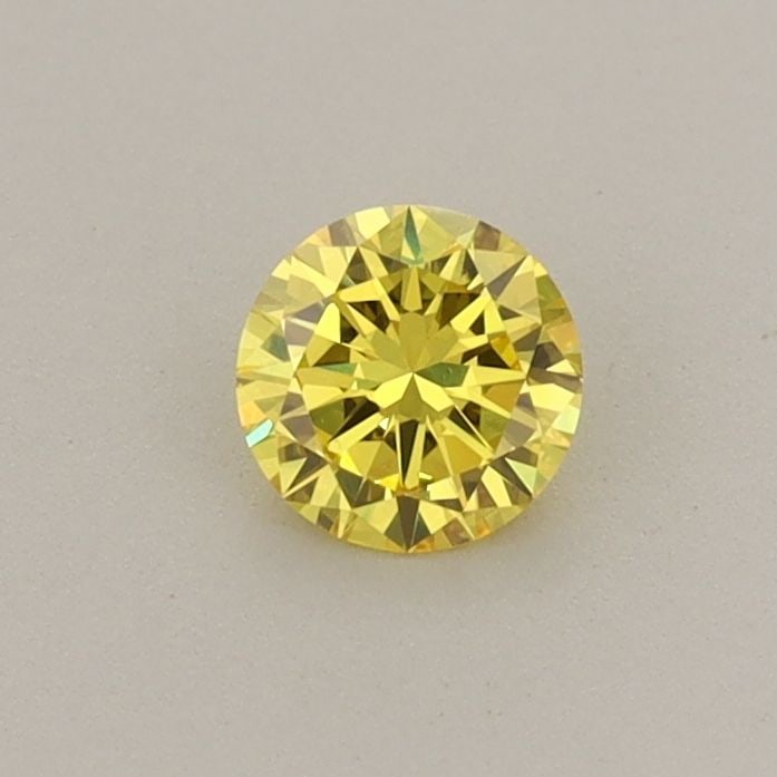 Loose Diamond - ROUND 0.3ct Fancy Vivid Yellow VS2: Loose Diamond - ROUND 0.3ct Fancy Vivid Yellow VS2 Source: This is a real non-mined Diamond that has been grown in a lab Shape: ROUND Carats: 0.3 Color: Fancy Vivid Yellow Certification: IGI Video: