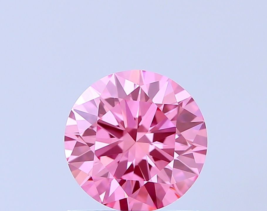 Ideal Loose Diamond - ROUND 0.9ct Fancy Vivid Pink VVS2: Ideal Loose Diamond - ROUND 0.9ct Fancy Vivid Pink VVS2 Source: This is a real non-mined Diamond that has been grown in a lab Shape: ROUND Carats: 0.9 Color: Fancy Vivid Pink Certification: IGI The Di