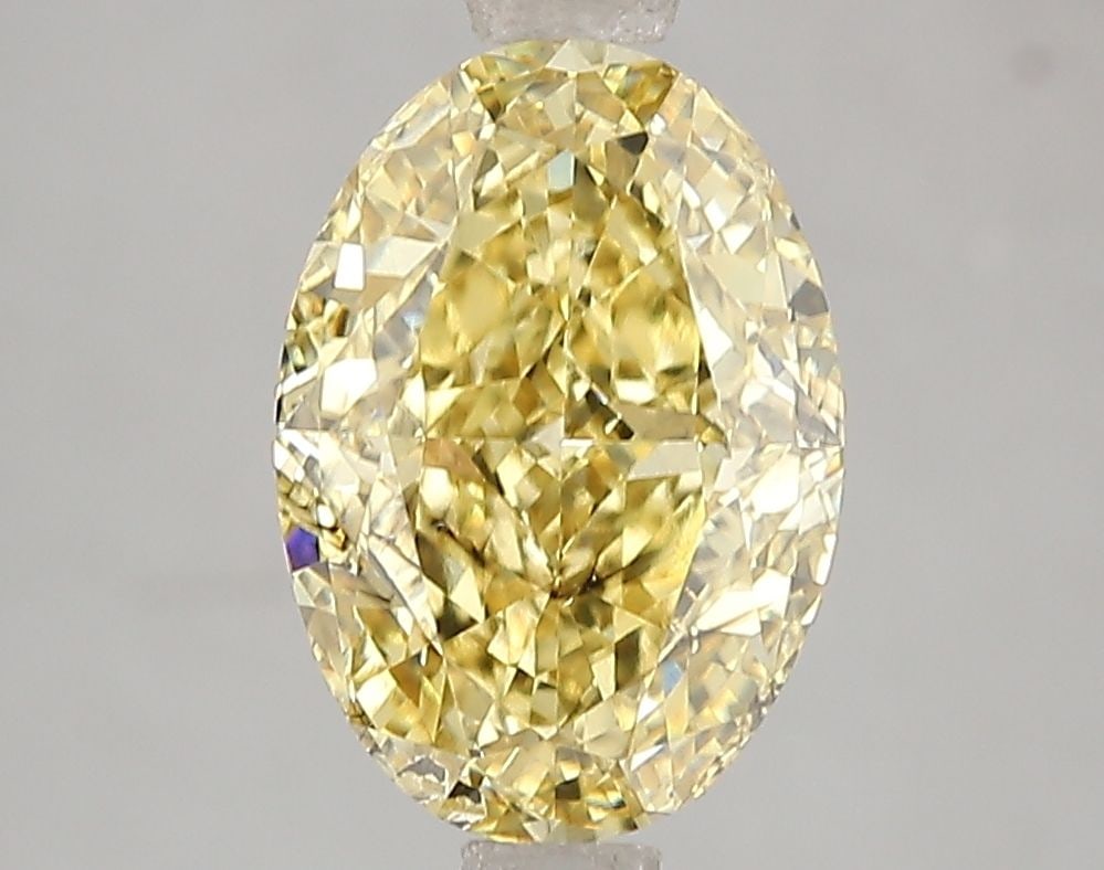 Loose Diamond - OVAL 3.02ct Fancy Vivid Yellow SI2: Loose Diamond - OVAL 3.02ct Fancy Vivid Yellow SI2 Source: This is a real non-mined Diamond that has been grown in a lab Shape: OVAL Carats: 3.02 Color: Fancy Vivid Yellow Certification: IGI Video: