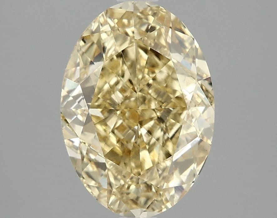 Loose Diamond - OVAL 3.03ct Fancy Vivid Yellow VS1: Loose Diamond - OVAL 3.03ct Fancy Vivid Yellow VS1 Source: This is a real non-mined Diamond that has been grown in a lab Shape: OVAL Carats: 3.03 Color: Fancy Vivid Yellow Certification: IGI Video: