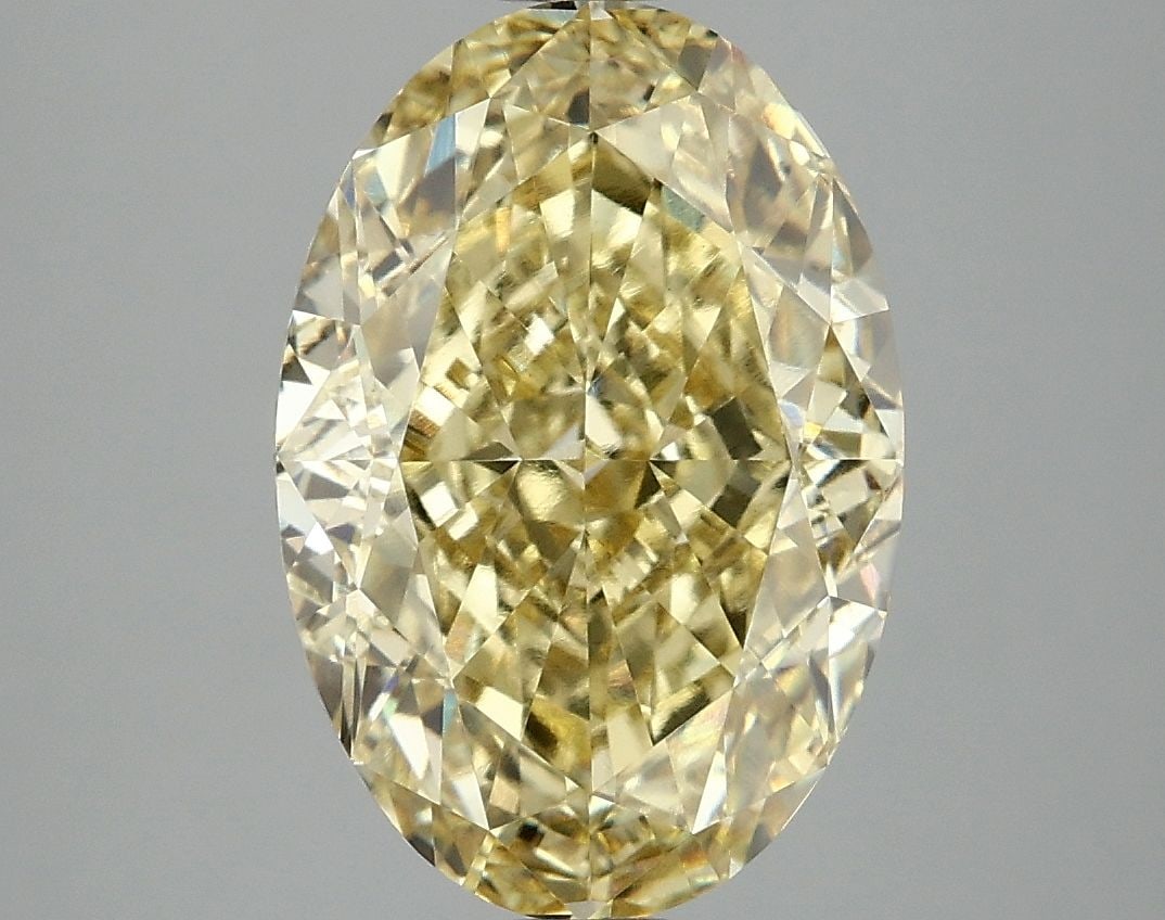 Loose Diamond - OVAL 5.1ct Fancy Vivid Yellow VVS2: Loose Diamond - OVAL 5.1ct Fancy Vivid Yellow VVS2 Source: This is a real non-mined Diamond that has been grown in a lab Shape: OVAL Carats: 5.1 Color: Fancy Vivid Yellow Certification: IGI Video: