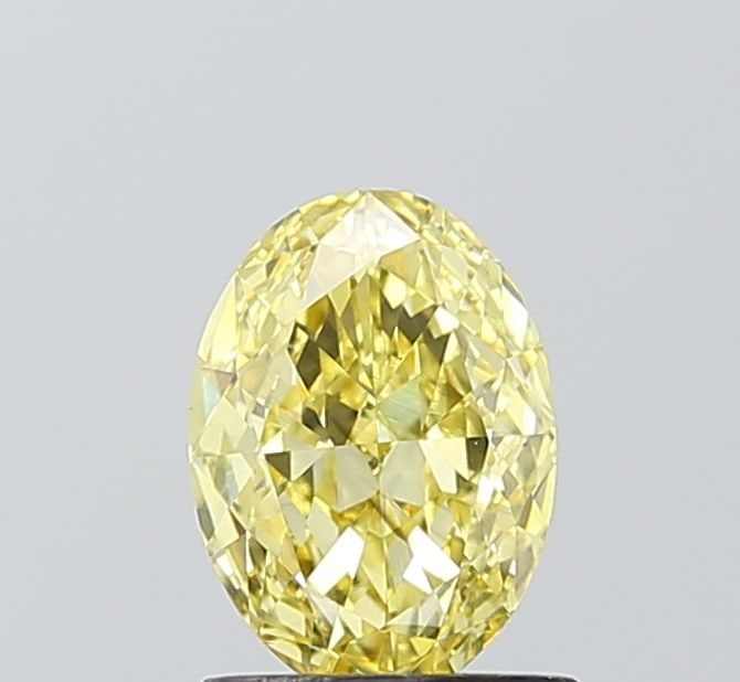 Loose Diamond - OVAL 1.1ct Fancy Intense Yellow VS2: Loose Diamond - OVAL 1.1ct Fancy Intense Yellow VS2 Source: This is a real non-mined Diamond that has been grown in a lab Shape: OVAL Carats: 1.1 Color: Fancy Intense Yellow Certification: IGI The Dia