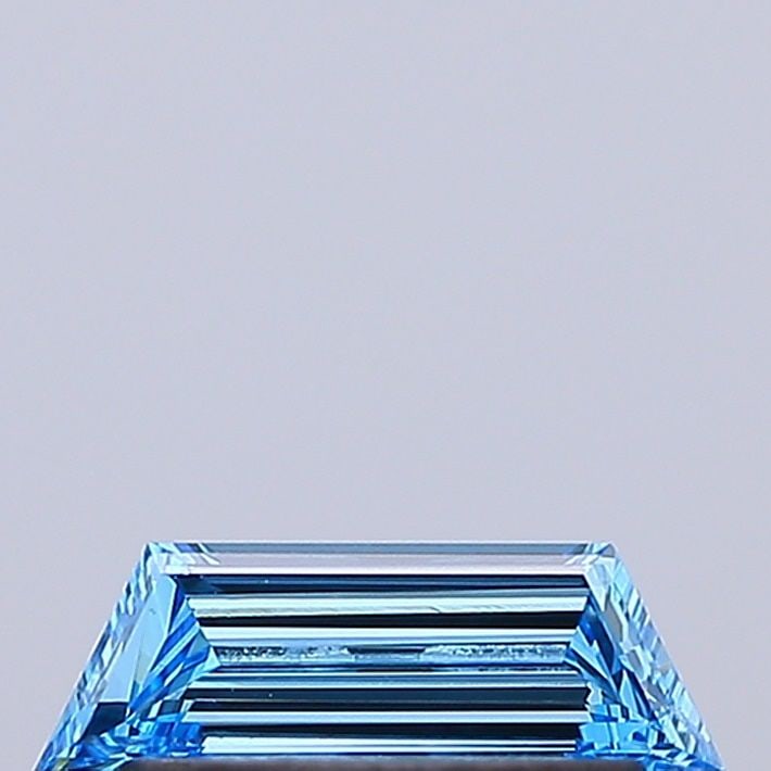 Loose Diamond - TRAPEZOID 0.29ct Fancy Vivid Blue VVS2: Loose Diamond - TRAPEZOID 0.29ct Fancy Vivid Blue VVS2 Source: This is a real non-mined Diamond that has been grown in a lab Shape: TRAPEZOID Carats: 0.29 Color: Fancy Vivid Blue Certification: IGI Vi