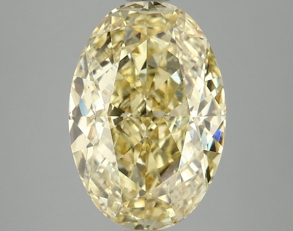 Loose Diamond - OVAL 4.1ct Fancy Vivid Yellow VVS2: Loose Diamond - OVAL 4.1ct Fancy Vivid Yellow VVS2 Source: This is a real non-mined Diamond that has been grown in a lab Shape: OVAL Carats: 4.1 Color: Fancy Vivid Yellow Certification: IGI Video: