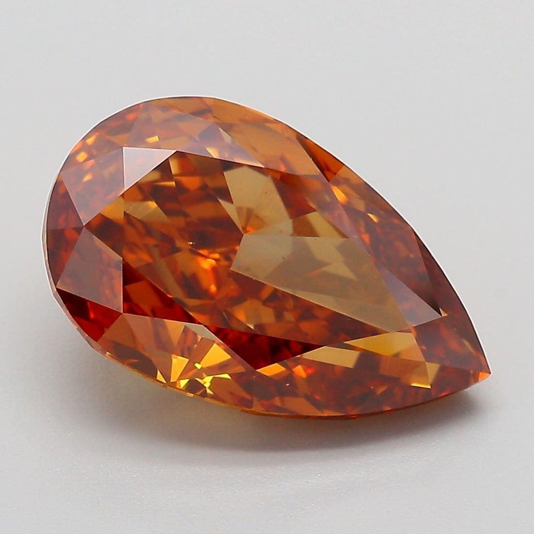 Loose Diamond - PEAR 5.15ct Fancy Vivid Brownish Orange VVS2: Loose Diamond - PEAR 5.15ct Fancy Vivid Brownish Orange VVS2 Source: This is a real non-mined Diamond that has been grown in a lab Shape: PEAR Carats: 5.15 Color: Fancy Vivid Brownish Orange Certifica