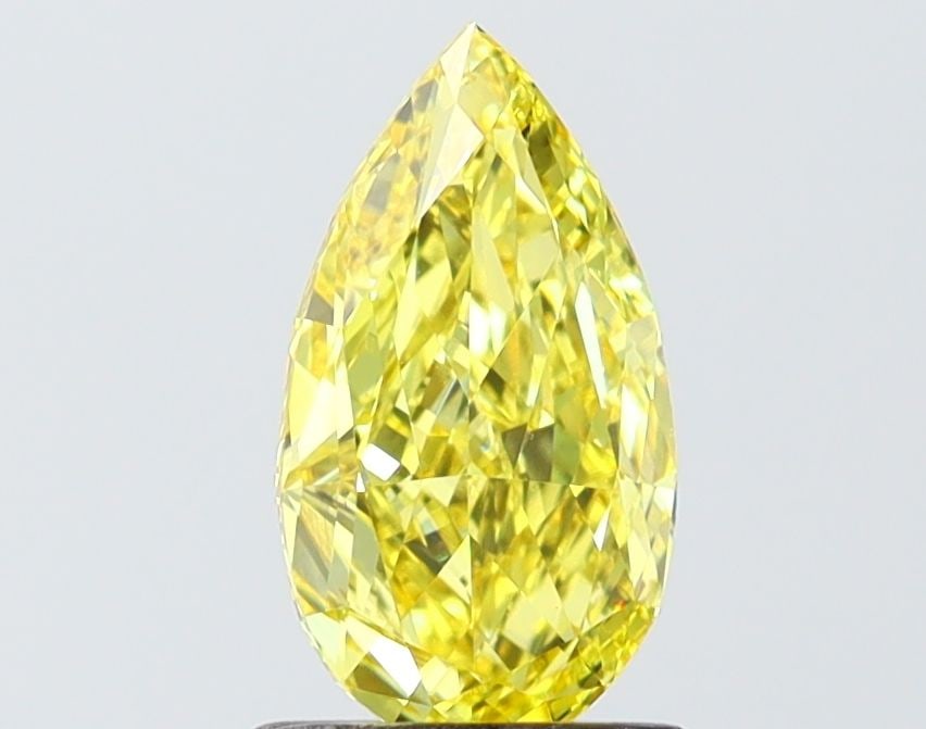 Loose Diamond - PEAR 1.32ct Fancy Vivid Yellow VVS2: Loose Diamond - PEAR 1.32ct Fancy Vivid Yellow VVS2 Source: This is a real non-mined Diamond that has been grown in a lab Shape: PEAR Carats: 1.32 Color: Fancy Vivid Yellow Certification: IGI Video: