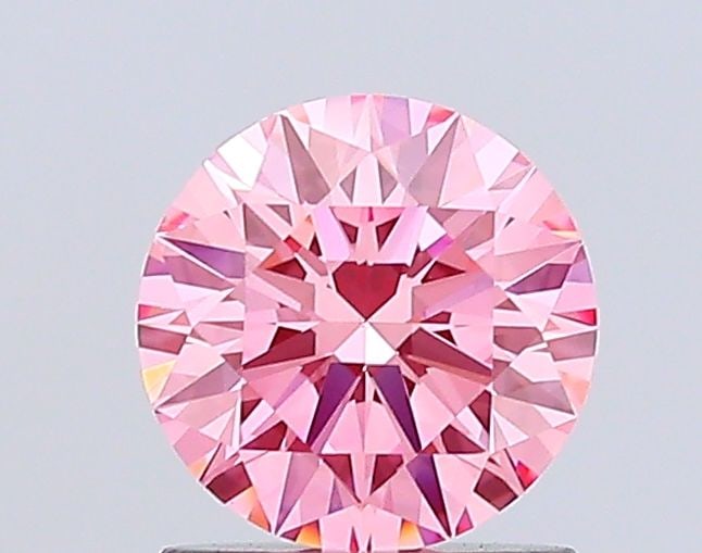 Ideal Loose Diamond - ROUND 1.05ct Fancy Vivid Pink VS1: Ideal Loose Diamond - ROUND 1.05ct Fancy Vivid Pink VS1 Source: This is a real non-mined Diamond that has been grown in a lab Shape: ROUND Carats: 1.05 Color: Fancy Vivid Pink Certification: IGI Video