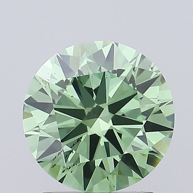 Ideal Loose Diamond - ROUND 1.45ct Fancy Vivid Green SI1: Ideal Loose Diamond - ROUND 1.45ct Fancy Vivid Green SI1 Source: This is a real non-mined Diamond that has been grown in a lab Shape: ROUND Carats: 1.45 Color: Fancy Vivid Green Certification: IGI Vid