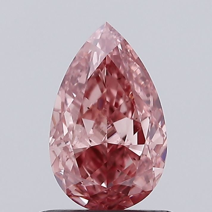 Loose Diamond - PEAR 1.0ct Fancy Vivid Pink VS2: Loose Diamond - PEAR 1.0ct Fancy Vivid Pink VS2 Source: This is a real non-mined Diamond that has been grown in a lab Shape: PEAR Carats: 1.0 Color: Fancy Vivid Pink Certification: IGI Video: