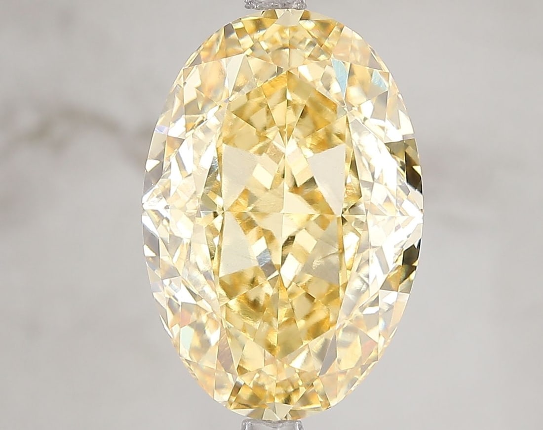 Loose Diamond - OVAL 7.11ct Fancy Vivid Yellow VS2: Loose Diamond - OVAL 7.11ct Fancy Vivid Yellow VS2 Source: This is a real non-mined Diamond that has been grown in a lab Shape: OVAL Carats: 7.11 Color: Fancy Vivid Yellow Certification: IGI Video: