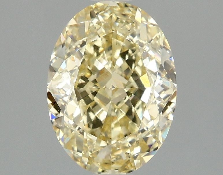 Loose Diamond - OVAL 2.1ct Fancy Yellow VS2: Loose Diamond - OVAL 2.1ct Fancy Yellow VS2 Source: This is a real non-mined Diamond that has been grown in a lab Shape: OVAL Carats: 2.1 Color: Fancy Yellow Certification: IGI Video: