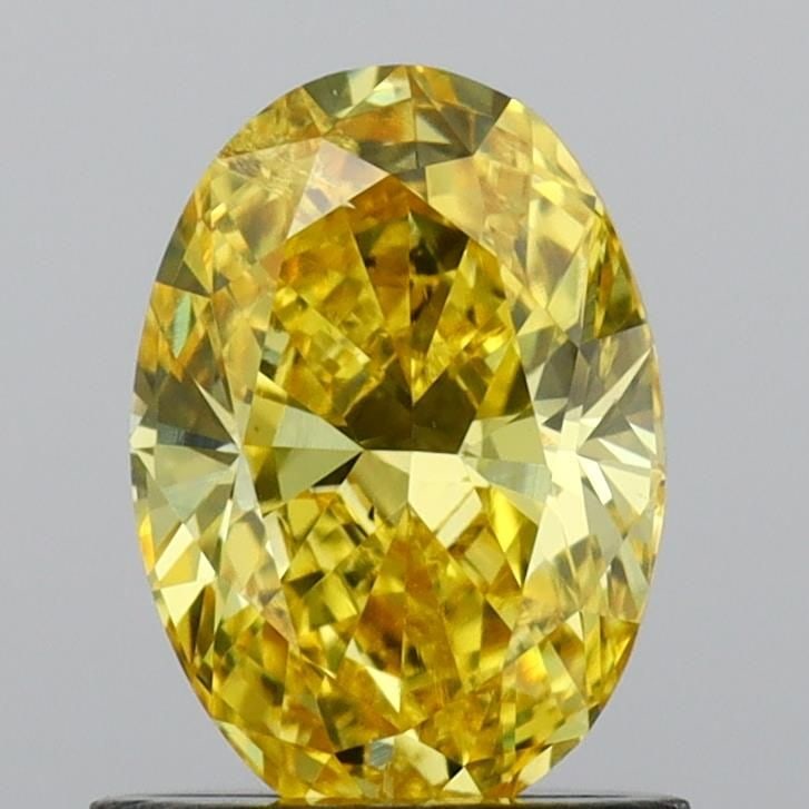 Loose Diamond - OVAL 0.99ct Fancy Vivid Yellow SI1: Loose Diamond - OVAL 0.99ct Fancy Vivid Yellow SI1 Source: This is a real non-mined Diamond that has been grown in a lab Shape: OVAL Carats: 0.99 Color: Fancy Vivid Yellow Certification: IGI Video: