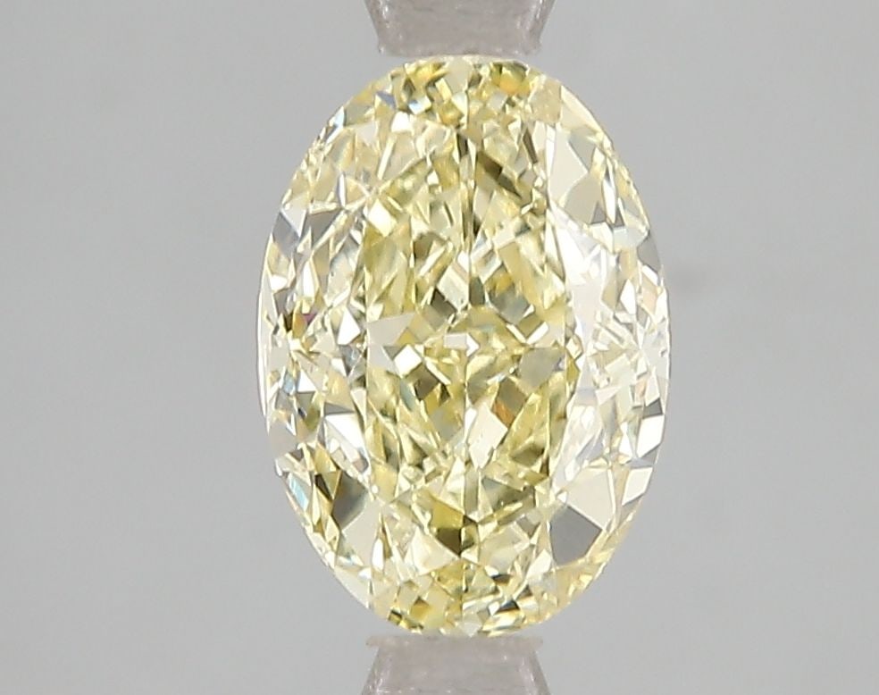 Loose Diamond - OVAL 2.05ct Fancy Intense Yellow VS2: Loose Diamond - OVAL 2.05ct Fancy Intense Yellow VS2 Source: This is a real non-mined Diamond that has been grown in a lab Shape: OVAL Carats: 2.05 Color: Fancy Intense Yellow Certification: IGI Video