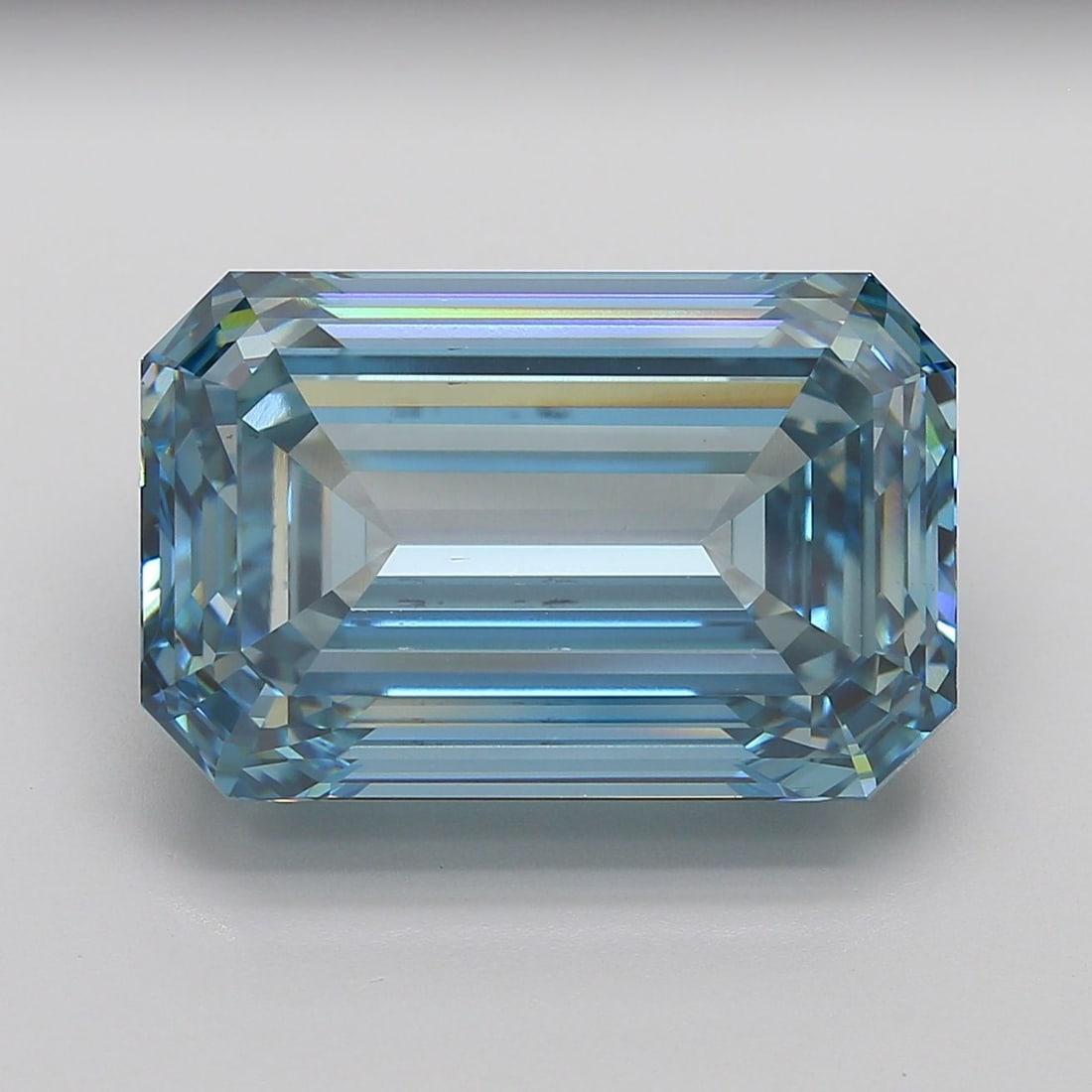 Loose Diamond - EMERALD 26.32ct Fancy Vivid Blue VS1: Loose Diamond - EMERALD 26.32ct Fancy Vivid Blue VS1 Source: This is a real non-mined Diamond that has been grown in a lab Shape: EMERALD Carats: 26.32 Color: Fancy Vivid Blue Certification: IGI Video
