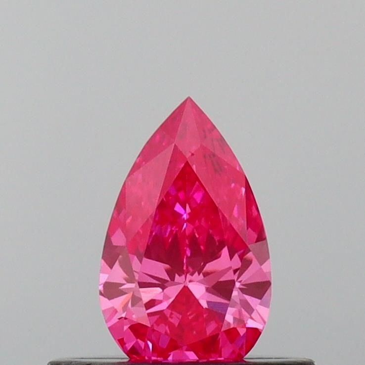 Loose Diamond - PEAR 0.32ct Fancy Vivid Pink VVS1: Loose Diamond - PEAR 0.32ct Fancy Vivid Pink VVS1 Source: This is a real non-mined Diamond that has been grown in a lab Shape: PEAR Carats: 0.32 Color: Fancy Vivid Pink Certification: IGI Video: