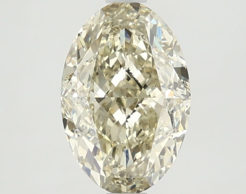 Loose Diamond - OVAL 2.6ct Fancy Vivid Yellow VS1: Loose Diamond - OVAL 2.6ct Fancy Vivid Yellow VS1 Source: This is a real non-mined Diamond that has been grown in a lab Shape: OVAL Carats: 2.6 Color: Fancy Vivid Yellow Certification: NONE The Diamon