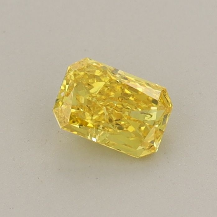 Loose Diamond - RADIANT 0.38ct Fancy Vivid Yellow VS2: Loose Diamond - RADIANT 0.38ct Fancy Vivid Yellow VS2 Source: This is a real non-mined Diamond that has been grown in a lab Shape: RADIANT Carats: 0.38 Color: Fancy Vivid Yellow Certification: IGI Vid