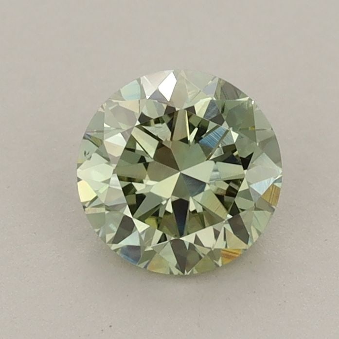 Loose Diamond - ROUND 0.81ct Fancy Vivid Green VS1: Loose Diamond - ROUND 0.81ct Fancy Vivid Green VS1 Source: This is a real non-mined Diamond that has been grown in a lab Shape: ROUND Carats: 0.81 Color: Fancy Vivid Green Certification: IGI Video: