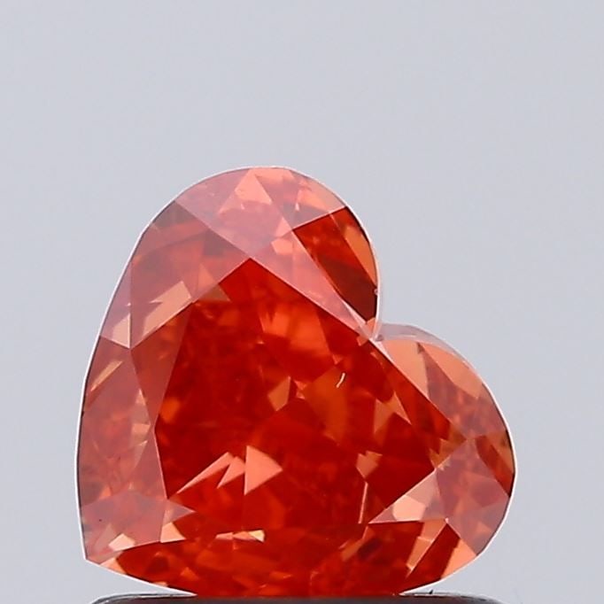 Loose Diamond - HEART 0.82ct Fancy Vivid Orange VS1: Loose Diamond - HEART 0.82ct Fancy Vivid Orange VS1 Source: This is a real non-mined Diamond that has been grown in a lab Shape: HEART Carats: 0.82 Color: Fancy Vivid Orange Certification: NONE Video: