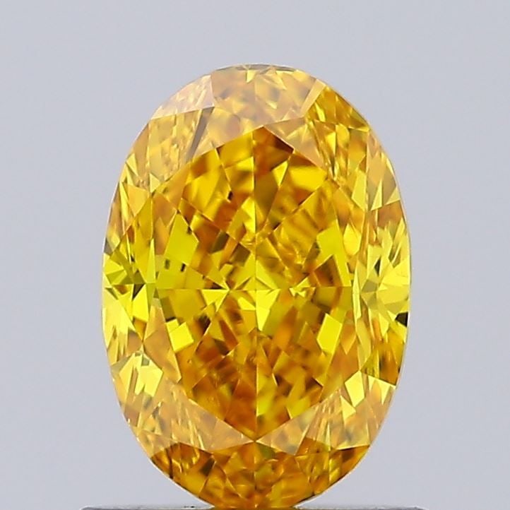 Loose Diamond - OVAL 0.89ct Fancy Vivid Yellow VVS2: Loose Diamond - OVAL 0.89ct Fancy Vivid Yellow VVS2 Source: This is a real non-mined Diamond that has been grown in a lab Shape: OVAL Carats: 0.89 Color: Fancy Vivid Yellow Certification: IGI Video: