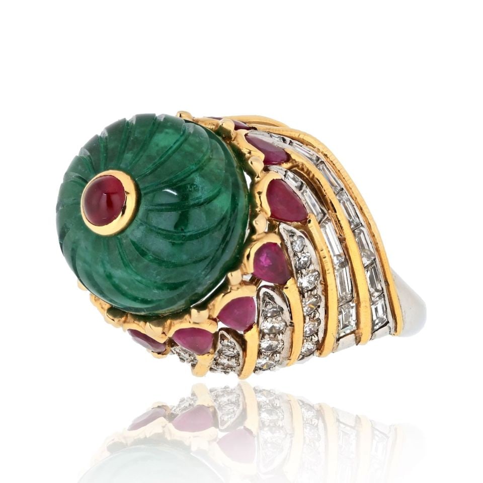 David Webb Mughal Emerald Ruby Cocktail Ring in Platinum and 18K Gold: David Webb Mughal Emerald Ruby Cocktail Ring in Platinum and 18K Gold Estate David Webb cocktail ring featuring a carved Mughal emerald accented by a ruby and surrounded by round and baguette diamonds