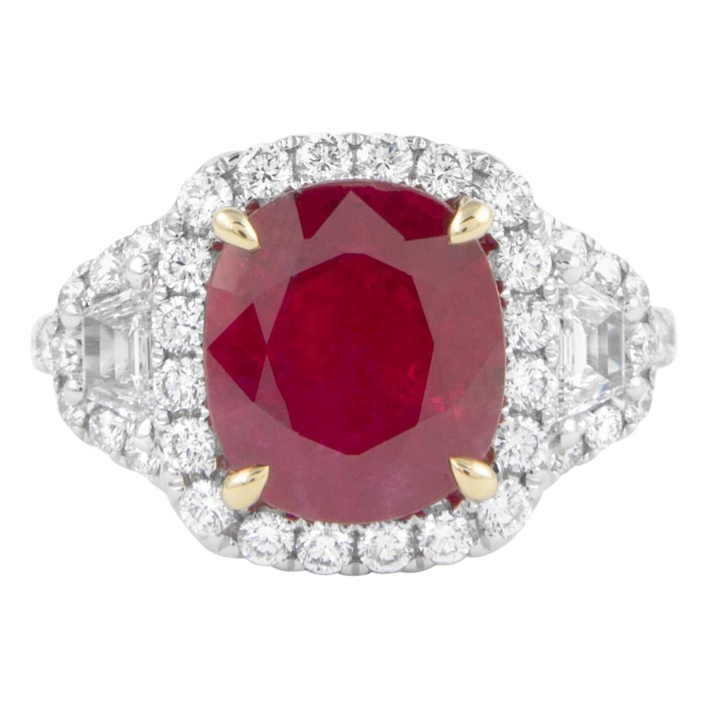 18k Gold Ring GIA 4.05ct Ruby Diamond Halo 3-Stone: 18k Gold Ring GIA 4.05ct Ruby Diamond Halo 3-Stone GIA-certified contemporary 3-stone halo ring featuring a vivid red oval ruby with trapezoid and round brilliant diamonds. Crafted in 18k white gold w