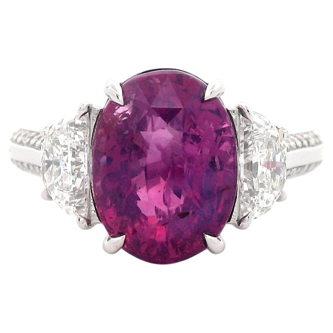 Platinum 3-Stone Ring 5.15ct No-Heat Pink Sapphire: Platinum 3-Stone Ring 5.15ct No-Heat Pink Sapphire Contemporary platinum three-stone ring featuring a GIA-certified 5.15 ct no-heat oval pink sapphire, flanked by two GIA-certified half-moon diamonds 