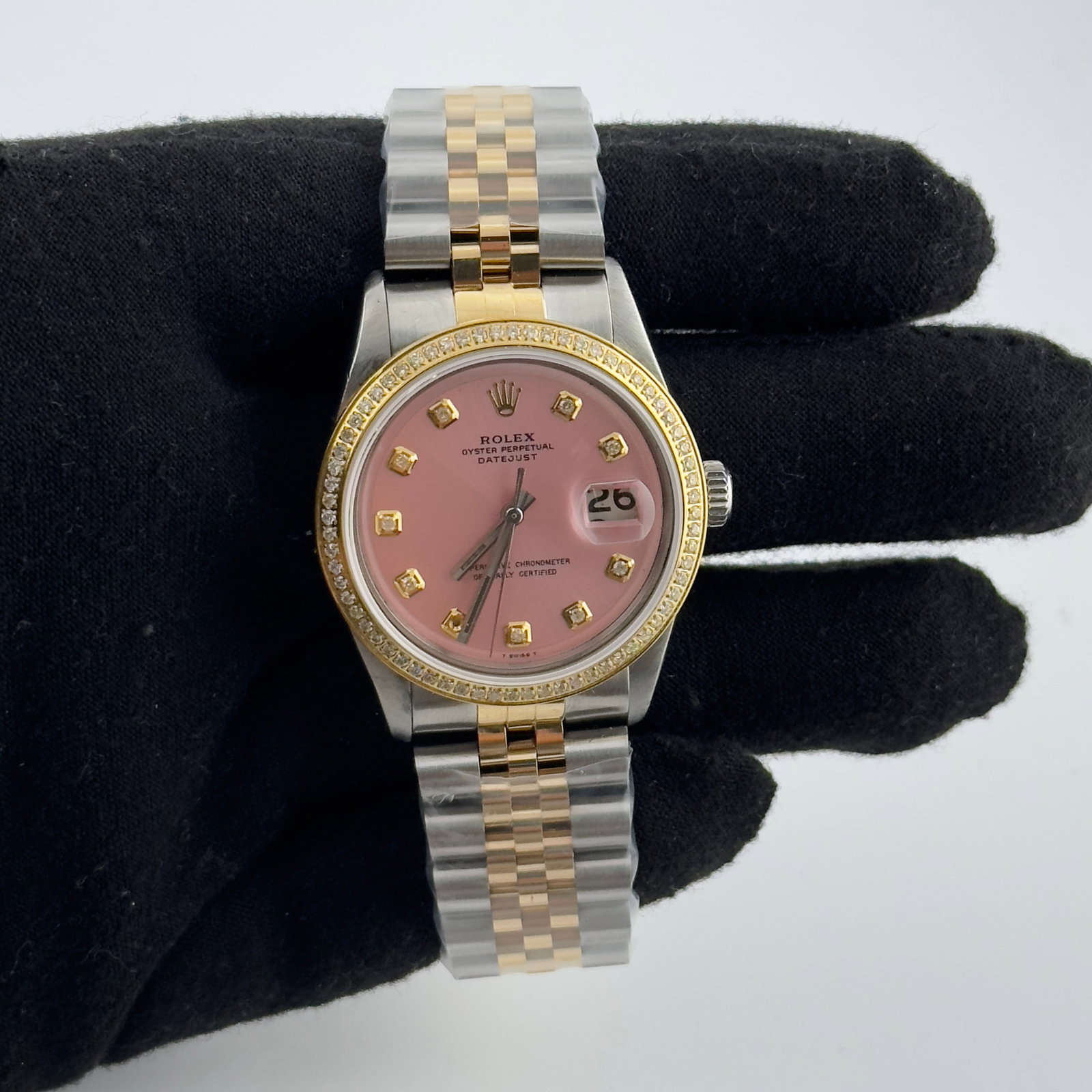Rolex Datejust Ref. 1601 Mens Watch aftermarket Pink Dial Jubilee Bracelet: Rolex Datejust Ref. 1601 Mens Watch aftermarket Pink Dial Jubilee Bracelet Rolex Datejust reference 1601 with an Aftermarket pink dial featuring yellow diamond markers, paired with an Aftermarket Jubi