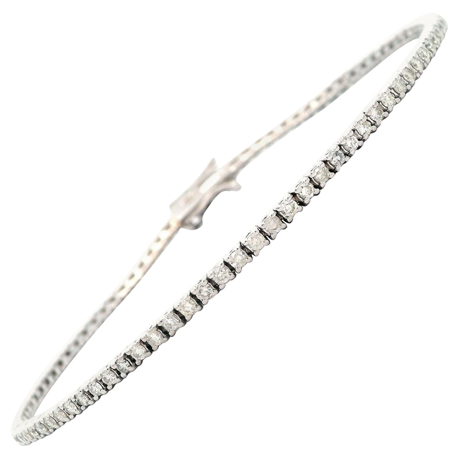 Diamond Tennis Bracelet 1.28ct 18k White Gold 7 in: Diamond Tennis Bracelet 1.28ct 18k White Gold 7 in Contemporary diamond tennis bracelet set with 90 round brilliant diamonds totaling 1.28 ct in 18k white gold. The diamonds are approximately J-L colo