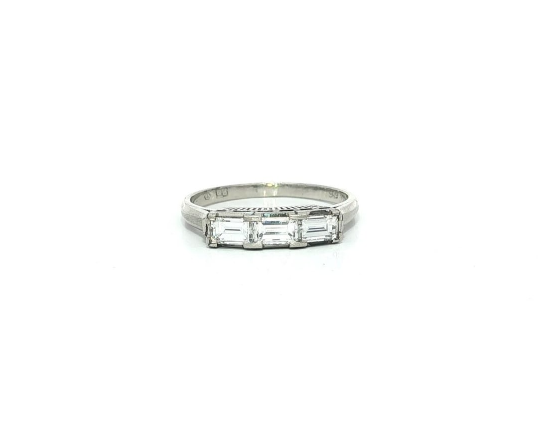 Platinum 3 Stone Baguette Diamond Band Ring 0.66ctw Size 6: Platinum 3 Stone Baguette Diamond Band Ring 0.66ctw Size 6 Vintage three-stone band ring crafted in solid platinum and set with natural baguette-cut diamonds in a long east-west design. This pre-owned