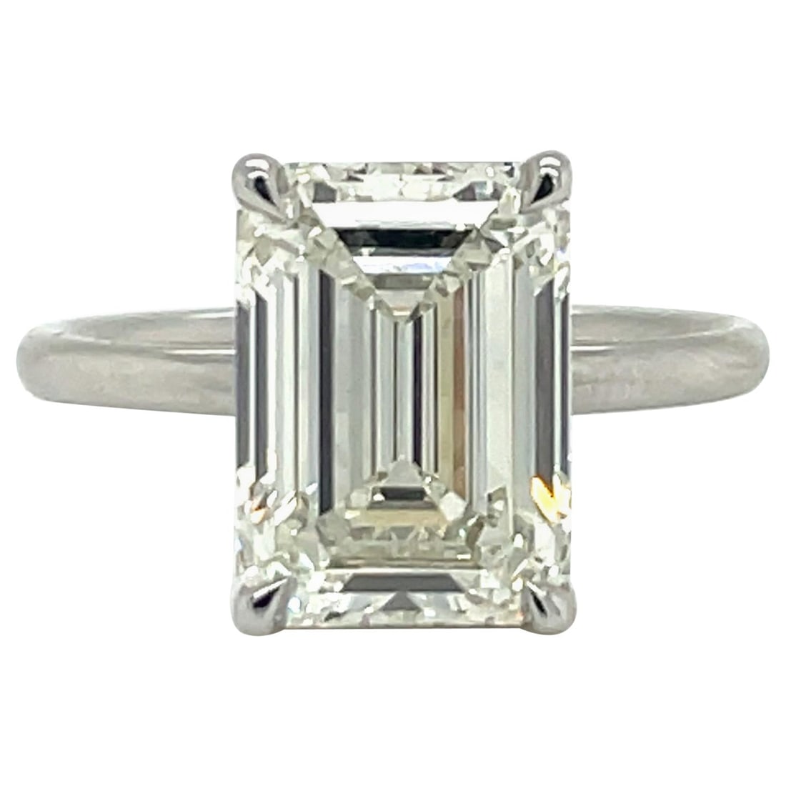 GIA Certified 5.01 Carat Emerald Cut Diamond Engagement Ring Platinum: GIA Certified 5.01 Carat Emerald Cut Diamond Engagement Ring Platinum This exquisite GIA Certified Emerald Cut Solitaire Diamond Engagement Ring features a stunning 5.01 carat diamond at its center, s