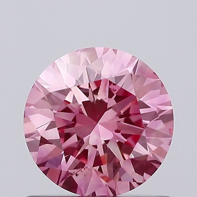 Loose Diamond - ROUND 0.82ct Fancy Vivid Pink VS2: Loose Diamond - ROUND 0.82ct Fancy Vivid Pink VS2 Source: This is a real non-mined Diamond that has been grown in a lab Shape: ROUND Carats: 0.82 Color: Fancy Vivid Pink Certification: IGI Video: