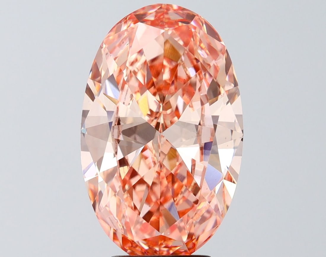 Loose Diamond - OVAL 5.03ct Fancy Vivid Orangey Pink VS1: Loose Diamond - OVAL 5.03ct Fancy Vivid Orangey Pink VS1 Source: This is a real non-mined Diamond that has been grown in a lab Shape: OVAL Carats: 5.03 Color: Fancy Vivid Orangey Pink Certification: I