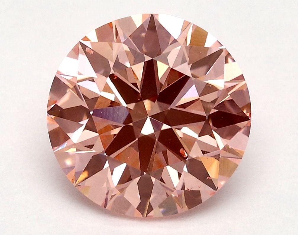 Ideal Loose Diamond - ROUND 2.2ct Fancy Vivid Pink VS2: Ideal Loose Diamond - ROUND 2.2ct Fancy Vivid Pink VS2 Source: This is a real non-mined Diamond that has been grown in a lab Shape: ROUND Carats: 2.2 Color: Fancy Vivid Pink Certification: IGI Video: