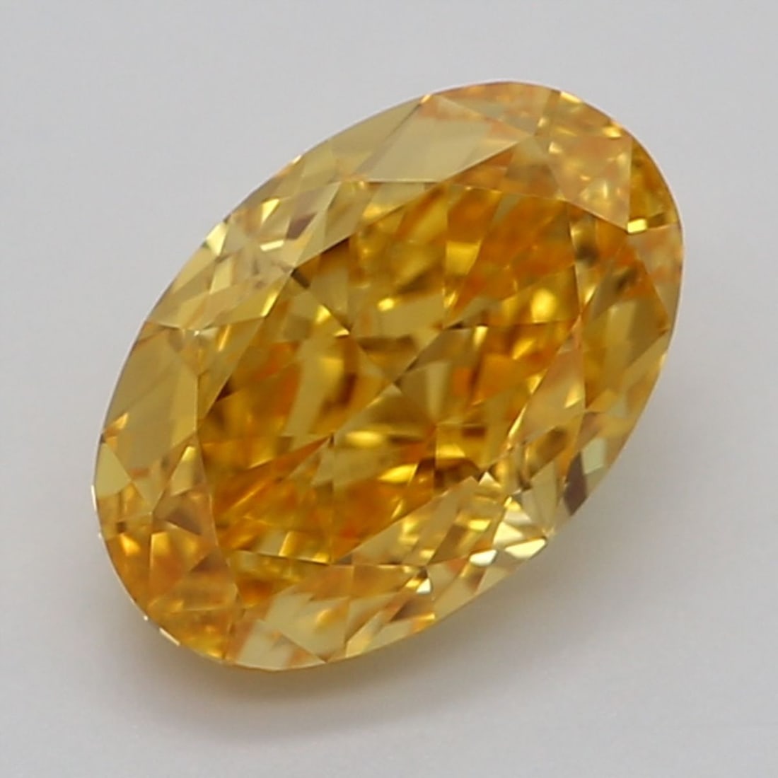 Loose Diamond - OVAL 0.7ct Fancy Vivid Orangey Yellow VVS1: Loose Diamond - OVAL 0.7ct Fancy Vivid Orangey Yellow VVS1 Source: Natural Shape: OVAL Carats: 0.7 Color: Fancy Vivid Orangey Yellow Certification: GIA Video: