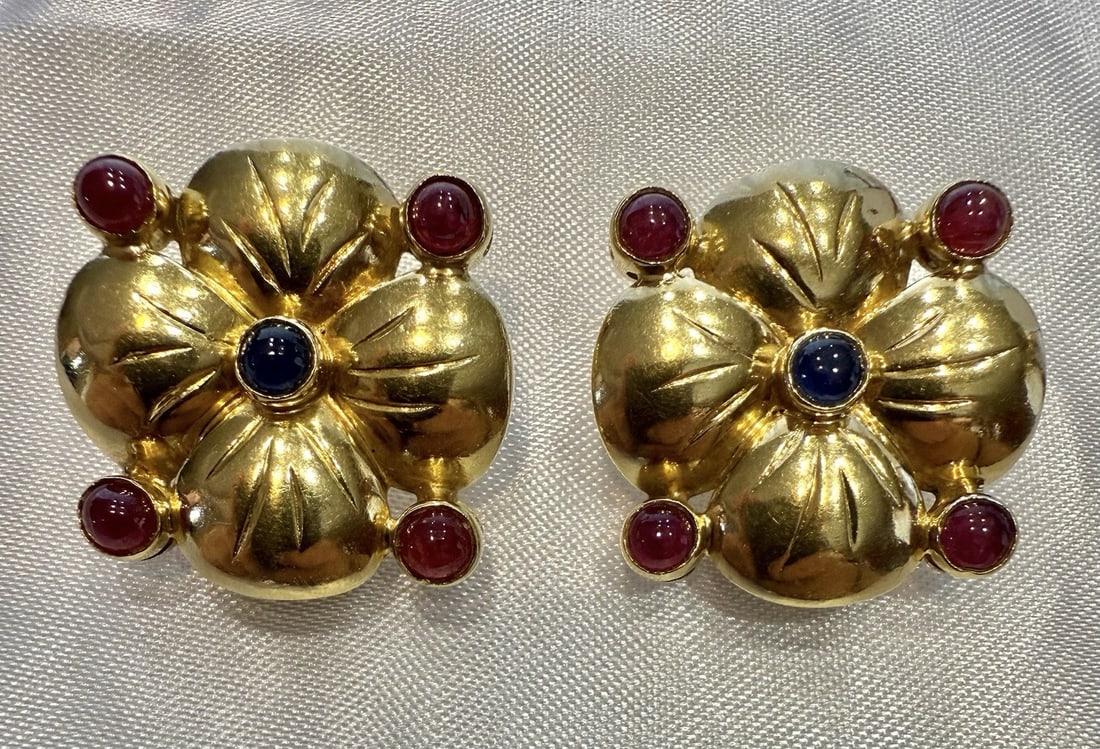 Pair of French 18K Multi Tone Gold Earrings with Ruby and Sapphire: Pair of French 18K Multi Tone Gold Earrings with Ruby and Sapphire Pair of French earrings crafted in 18K white and yellow gold, featuring ruby and sapphire accents in a cuff stud style. These pre-own