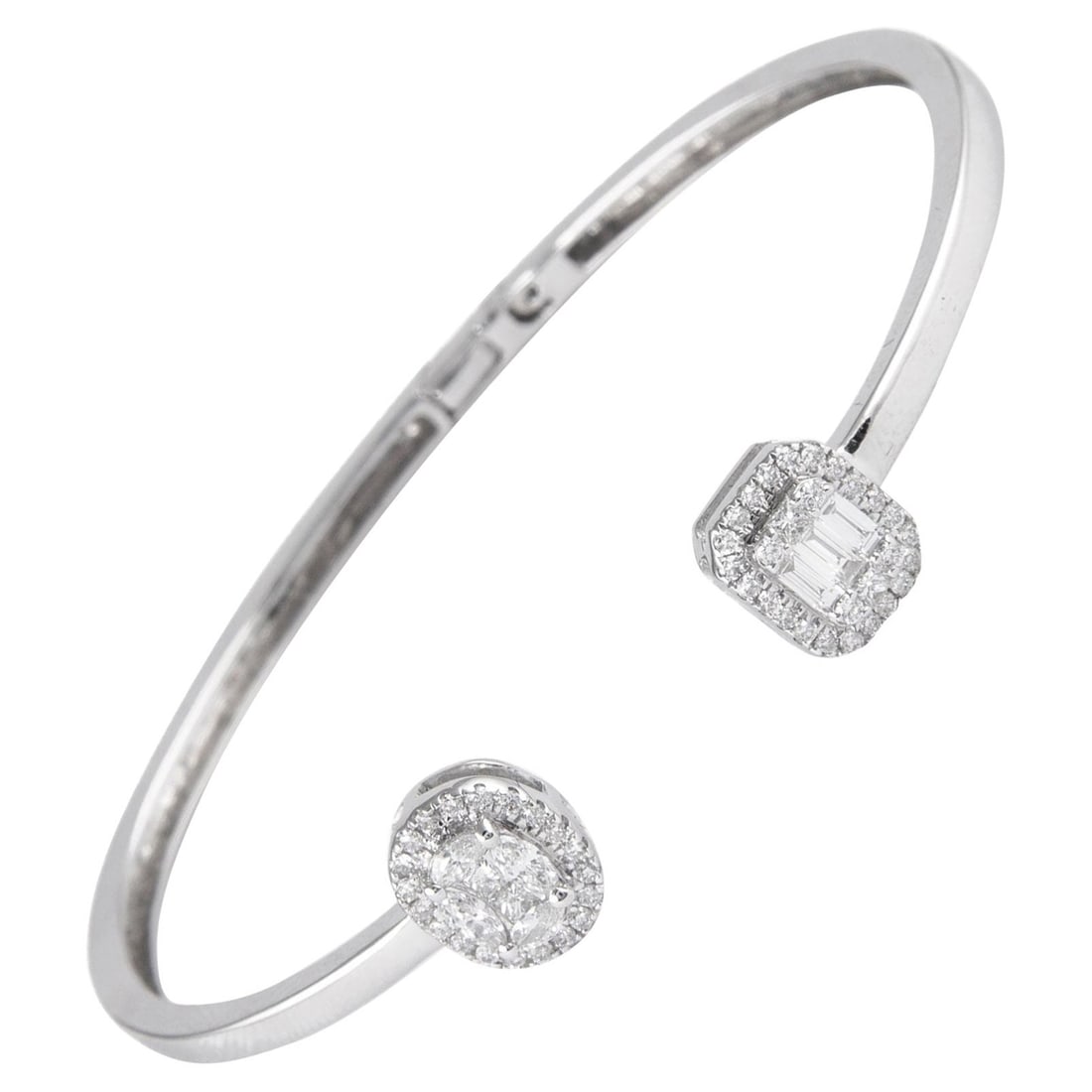 18K White Gold Diamond Open Bangle 0.83ct: 18K White Gold Diamond Open Bangle 0.83ct Modern open bangle bracelet in 18k white gold featuring 58 round-cut diamonds in an illusion setting designed to resemble oval and emerald-cut diamonds. This 